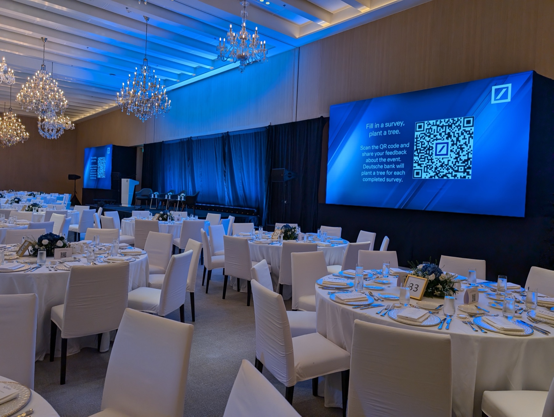 Corporate gala dinner with ambient lighting, LED screens and ballroom AVL