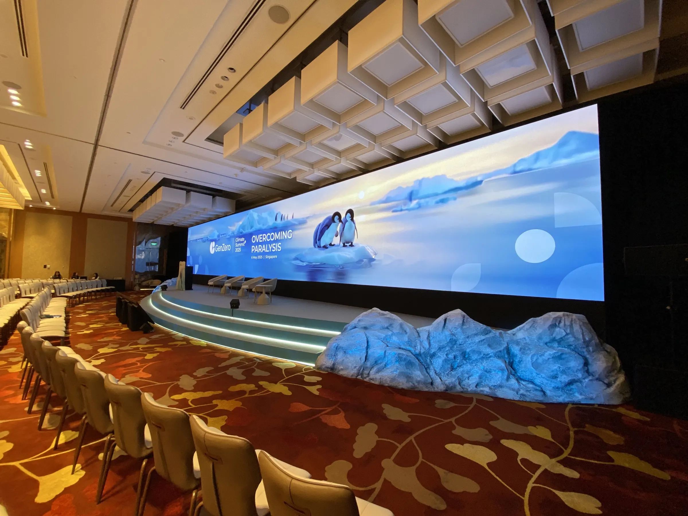 Leadership forum stage with scenic elements and panoramic LED wall