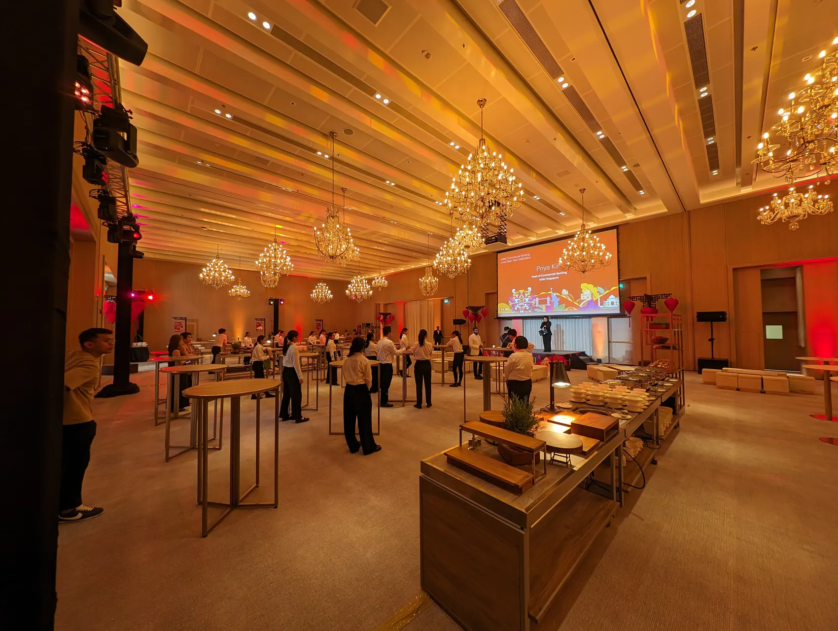 Dinner event setup with production lighting and ballroom staging