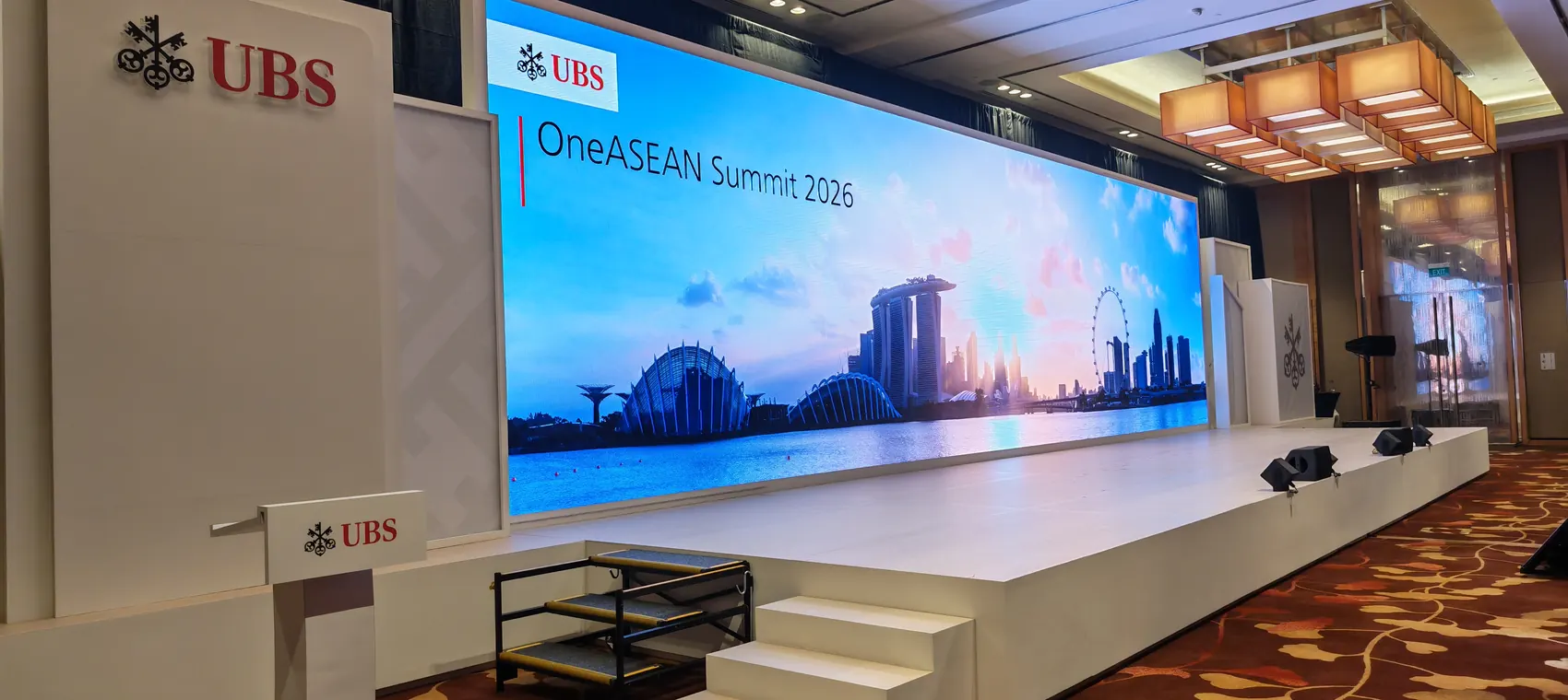 Corporate launch stage with LED wall and presentation setup